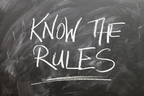 Black board with writings "Know the Rules"
